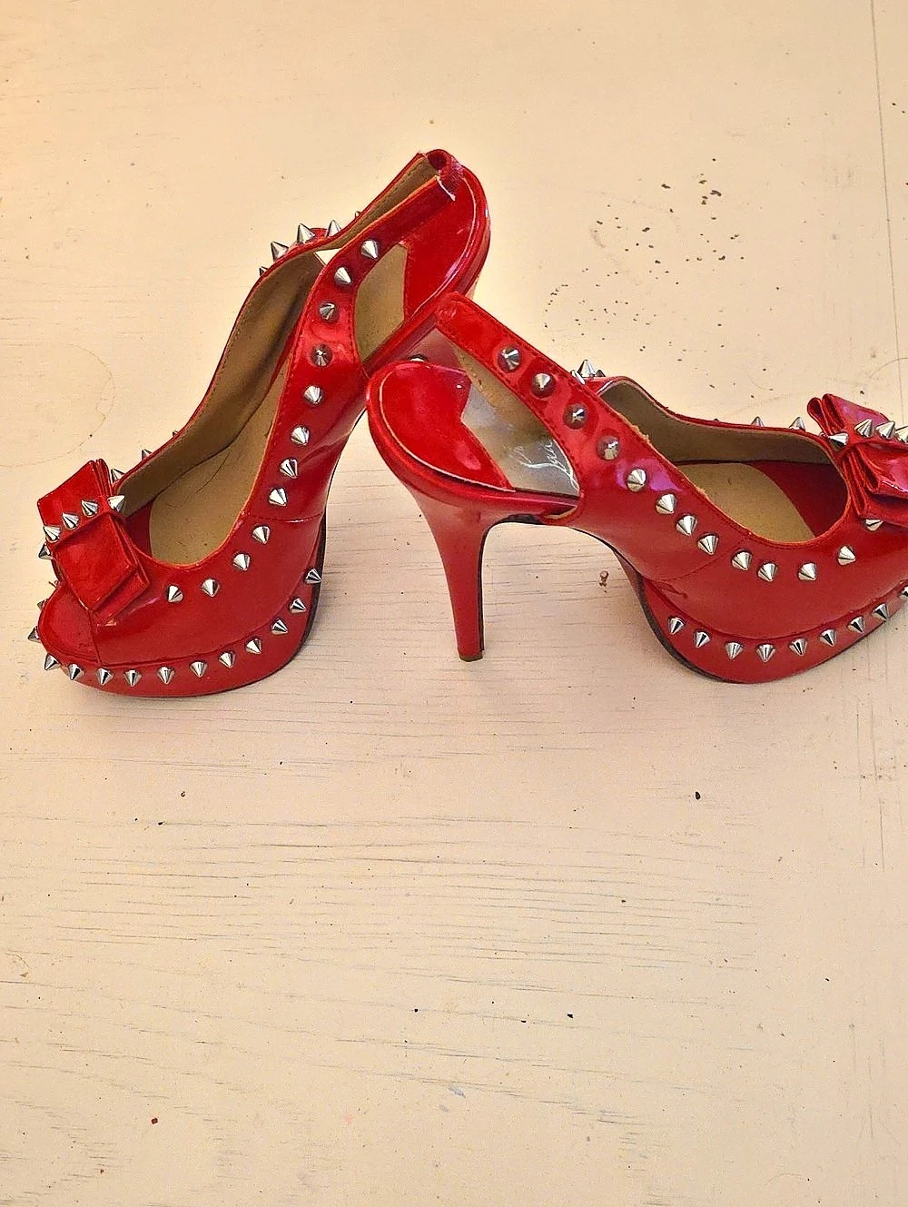 Christian Louboutin Red Studded Platform Heels With Bows